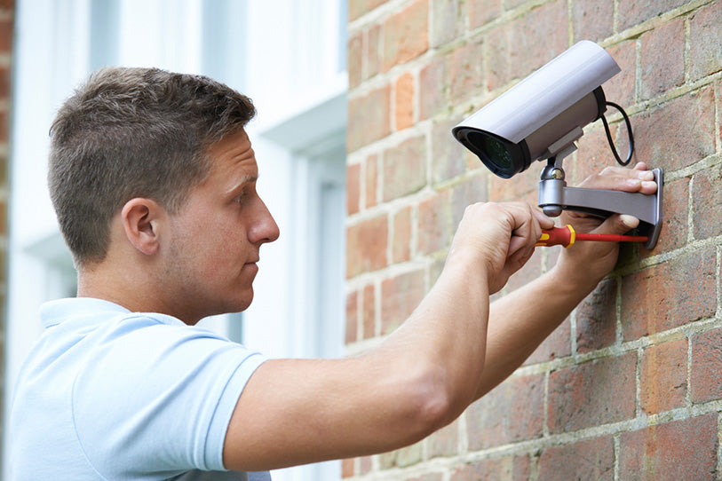 security consultant fitting camera