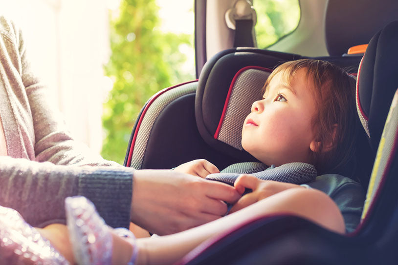 toddler girl in car seat